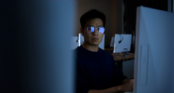 Computer hacker stealing information with computer