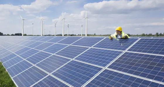 Worker on a solar panel