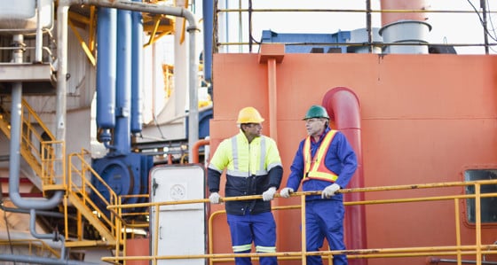 Two men on an oil rig