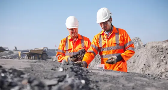 Two workers in a mine