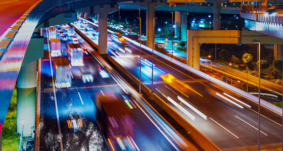 A busy motorway in the city at night