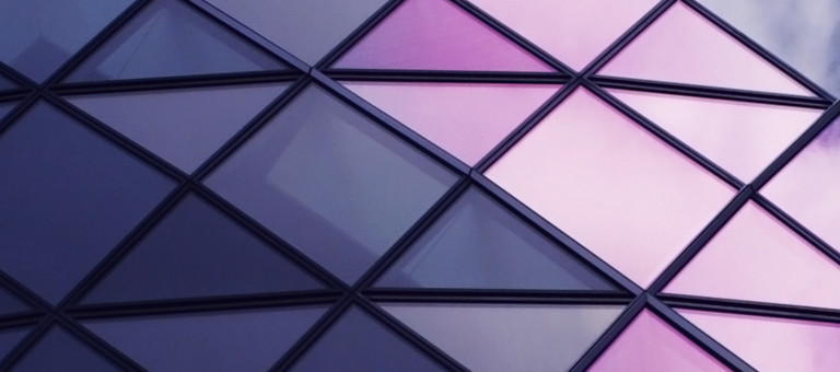 A close-up of coloured windows arranged in a diamond pattern