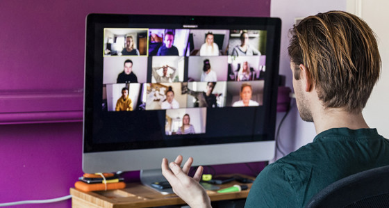 A man taking part in a video call meeting