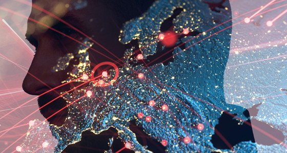 The silhouette of a man's head superimposed over the Earth lit up at night