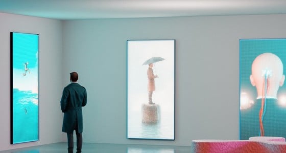 A man looking at images in a NFT Crypto art gallery