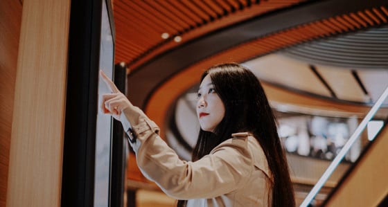 Woman touching a screen