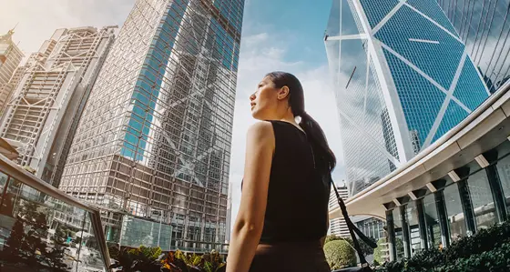 Woman walking in a busy city