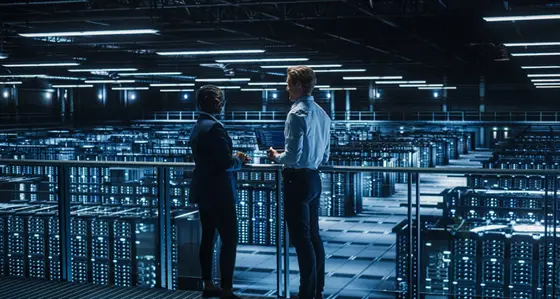 Two people having a conversation in a data centre