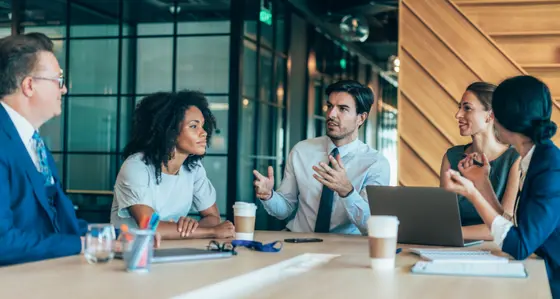 Group of business people talking around the conference table