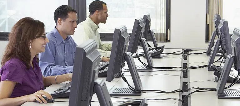 A group of people at computers