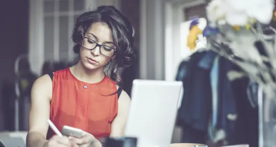 Woman working at a desk in her home