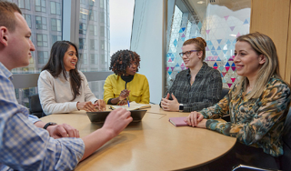 Team members having a discussion in a meeting room