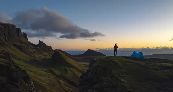 Man camping in the hills